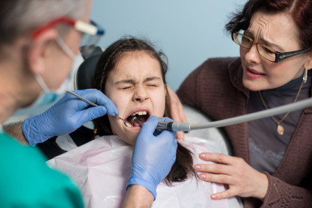 Dental specialists with a child