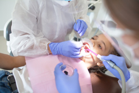 dental surgeon doing the oral examination