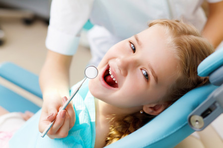 dentist checking a child