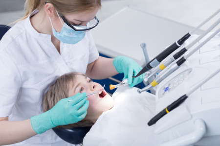 dentist doing routine dental checkup