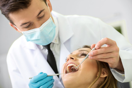 dentist treating woman patient