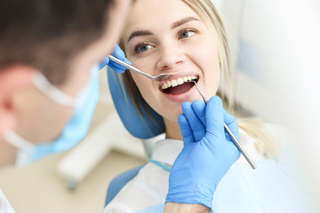 nearest dentist examine her teeth