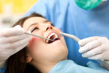 Dentist curing a cavity patient