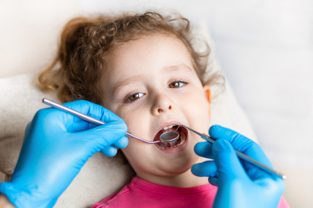 a kid having a dental checkup