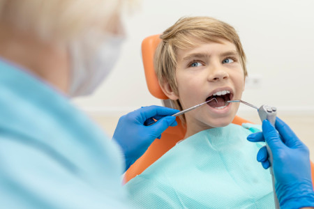 dentist checking a kid
