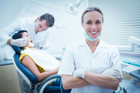 dentist examining woman's teeth