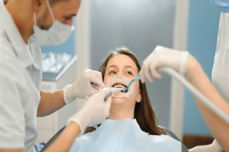 dentist operating in dental office