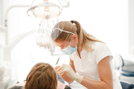 dentist at work with patient
