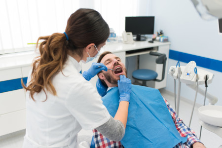dentist doing teeth checkup