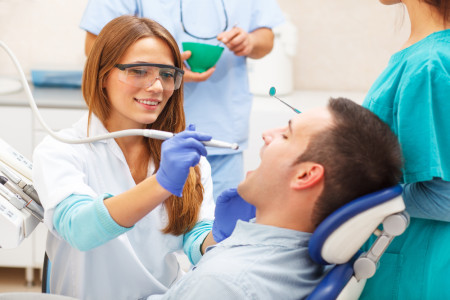 dentists examining in her clinic