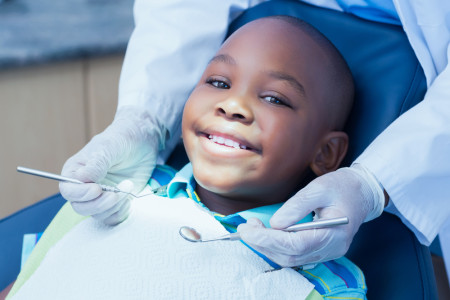 stomatologist examining child teeth