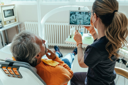 Dentist Explaining Teeth X-ray