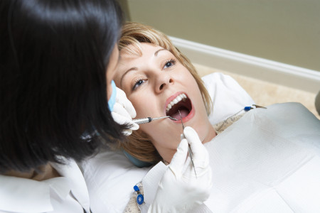 dentist checking female