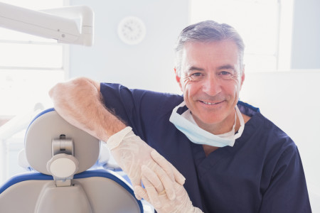 smiling dentist in dental clinic